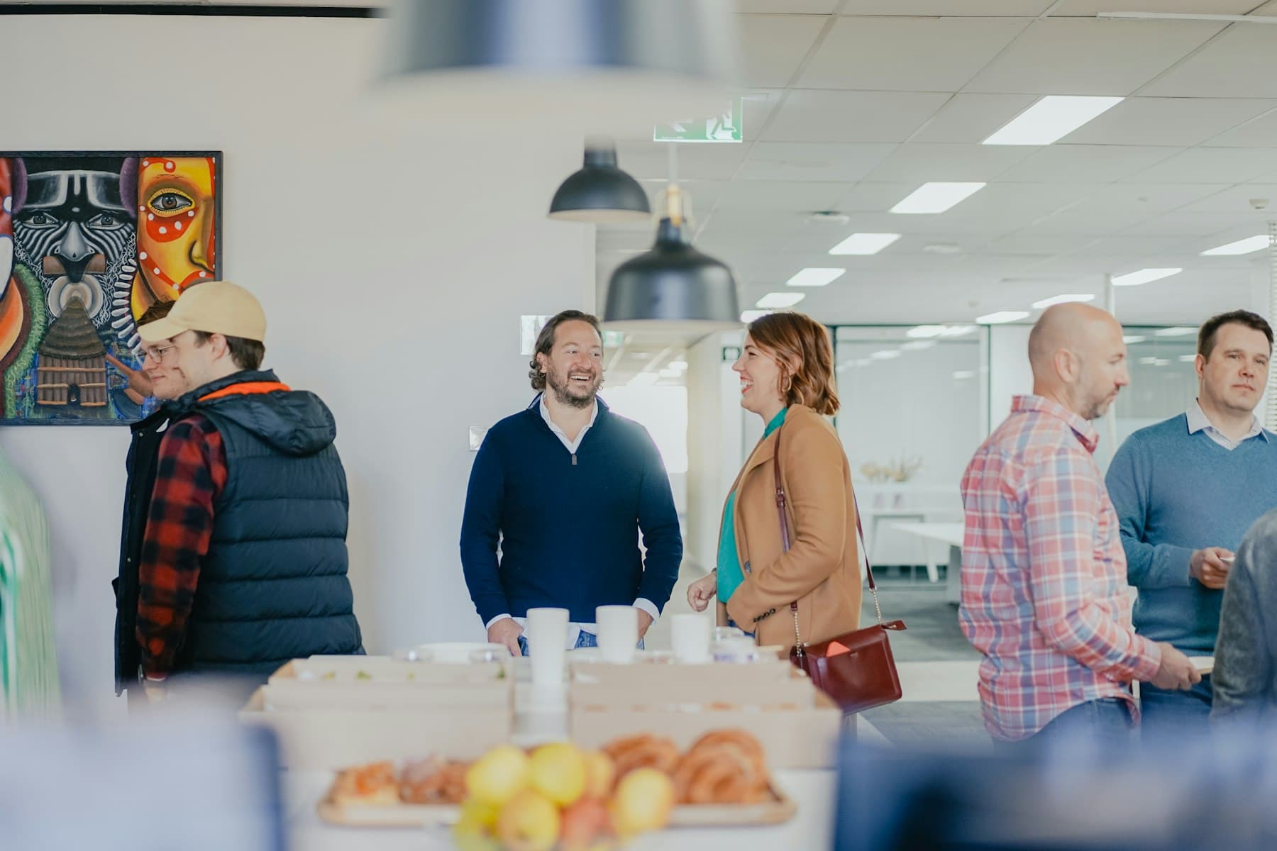 Colleagues gathered in a bright office